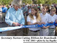 Secretary Norton Cutting Ribbon to open the Centennial Boardwalk